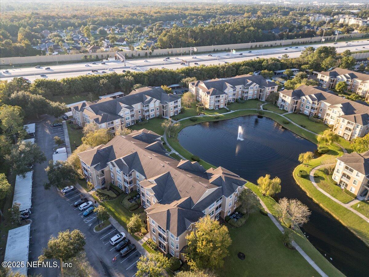 7990 Baymeadows Road East, Unit 913 Jacksonville, FL 32256 - Photo 59 of 70 an aerial view of a house with a lake view