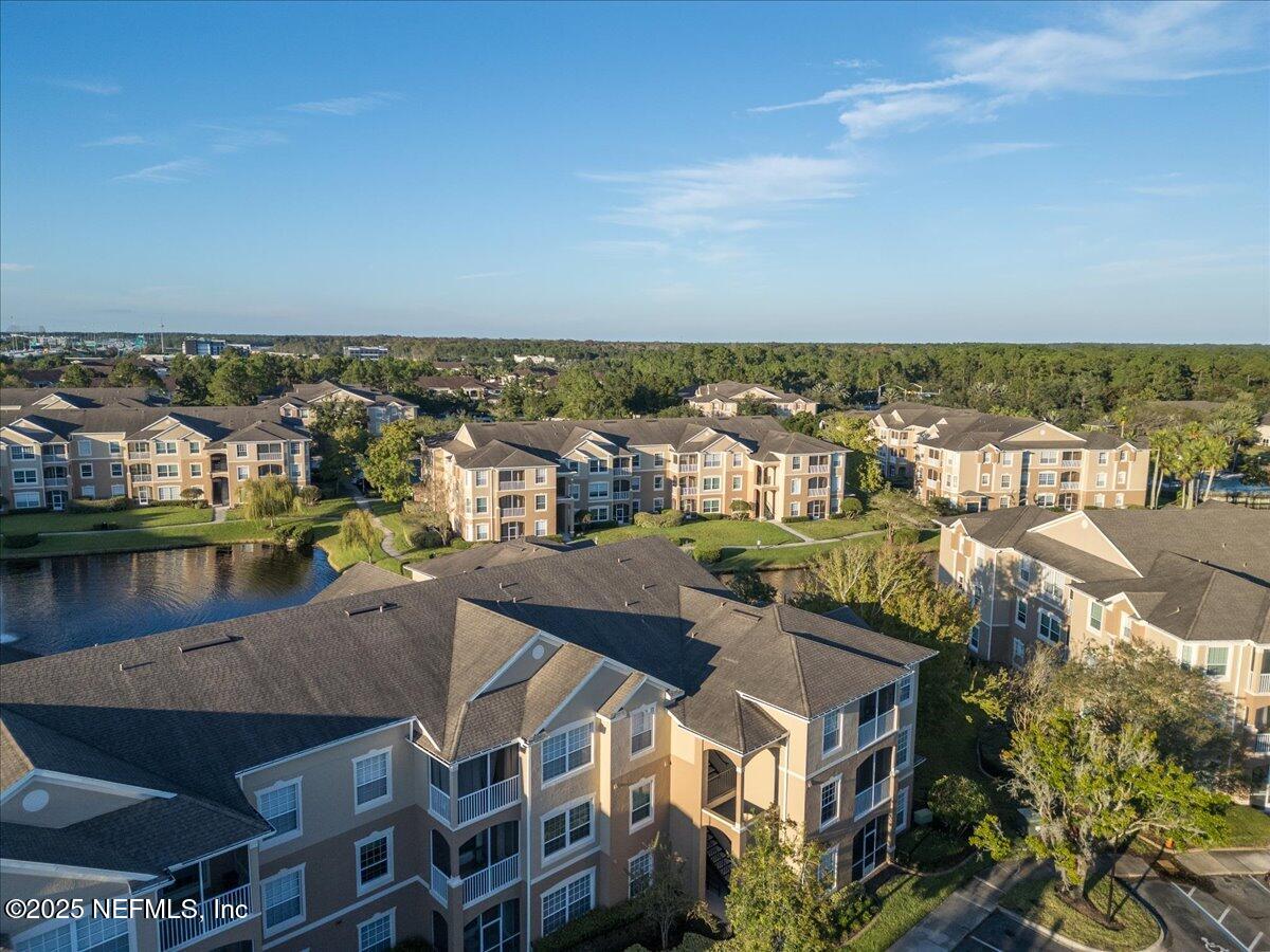7990 Baymeadows Road East, Unit 913 Jacksonville, FL 32256 - Photo 61 of 70 an aerial view of residential building with outdoor space and seating