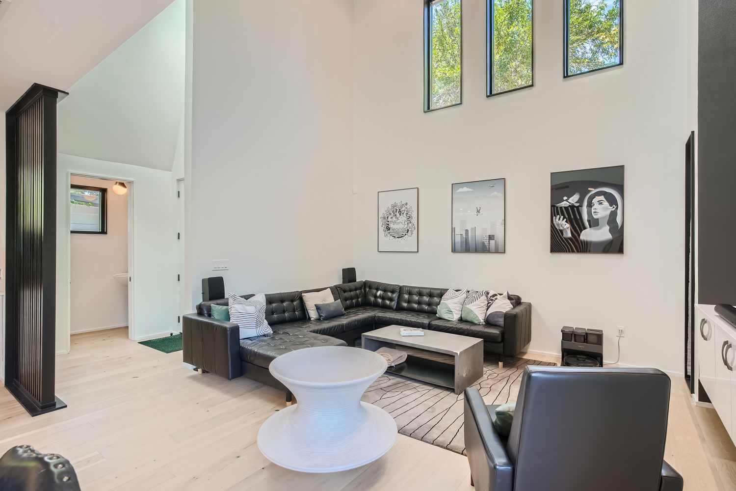 7525 Delafield Lane, Unit A Austin, TX 78752 - Photo 6 of 33 Living area featuring light wood finished floors and a high ceiling