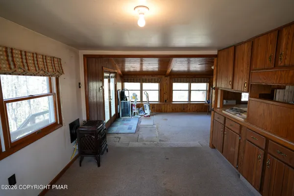 a lobby with furniture and floor to ceiling window