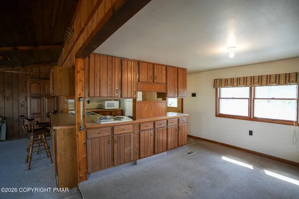 a kitchen with sink cabinets and window