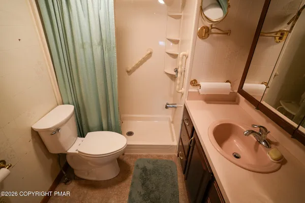 a bathroom with a sink and toilet