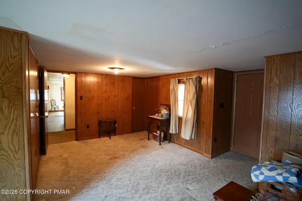 a view of a livingroom with furniture and a gate
