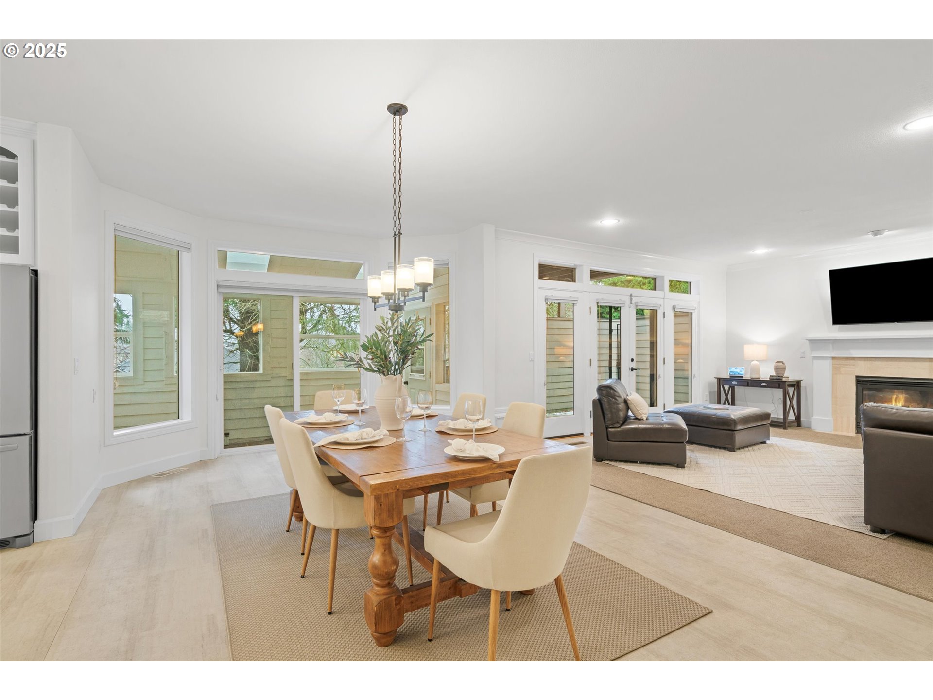 2711 Northwest 28th Circle Camas, WA 98607 - Photo 14 of 45 a dining room with furniture a chandelier and wooden floor