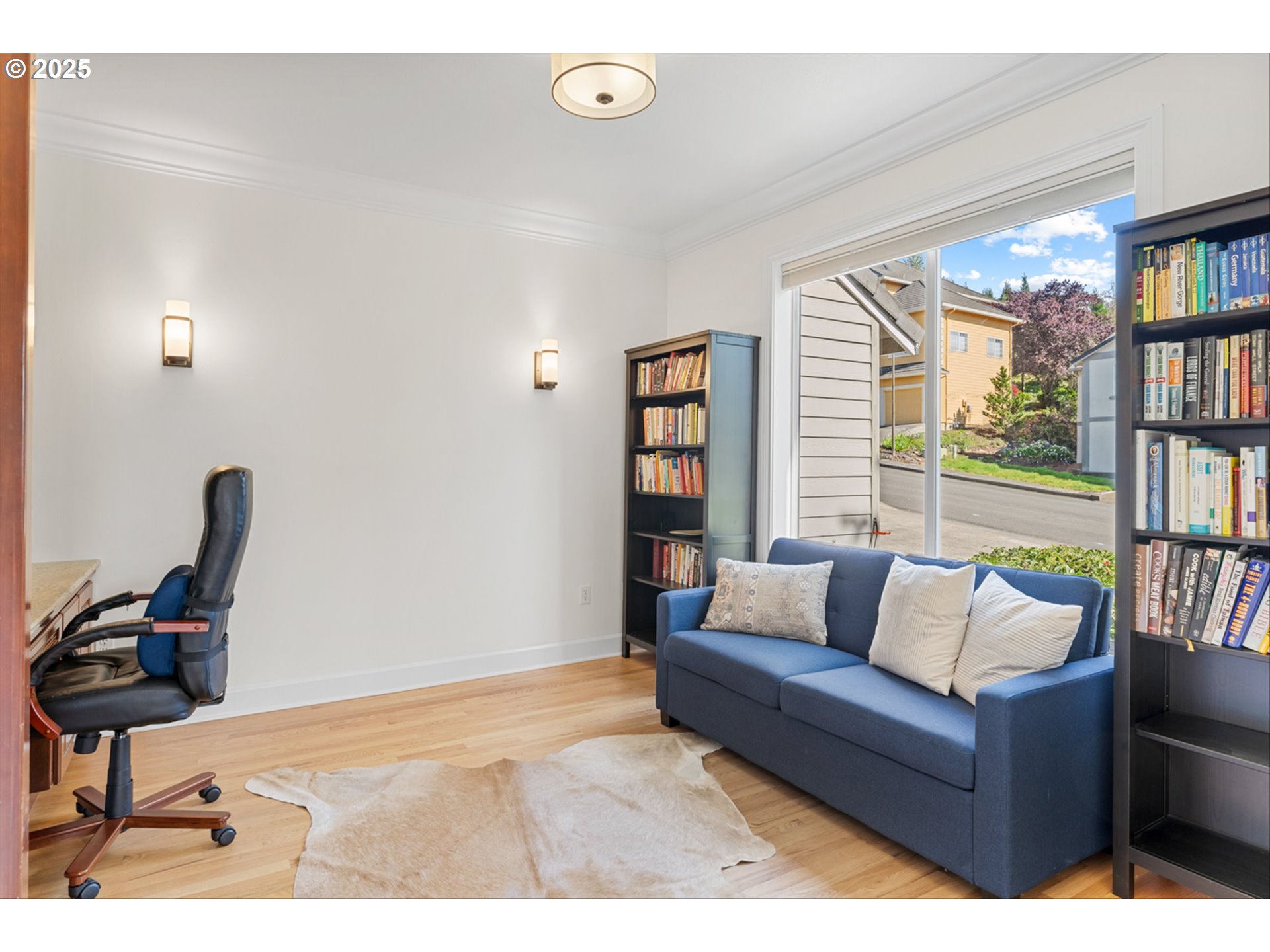 2711 Northwest 28th Circle Camas, WA 98607 - Photo 22 of 45 a living room with furniture and a book shelf