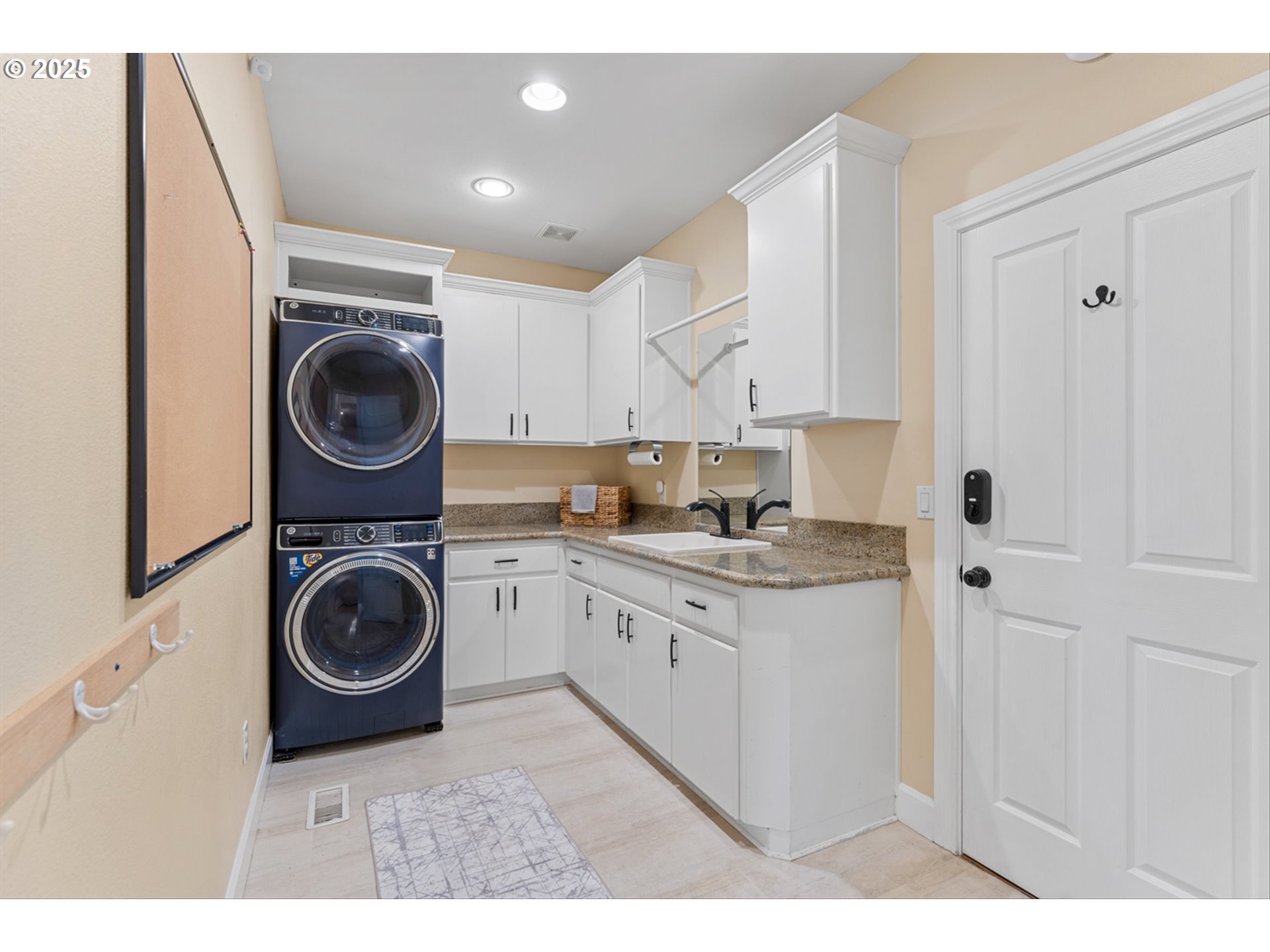 2711 Northwest 28th Circle Camas, WA 98607 - Photo 23 of 45 a kitchen with a stove top oven and cabinets