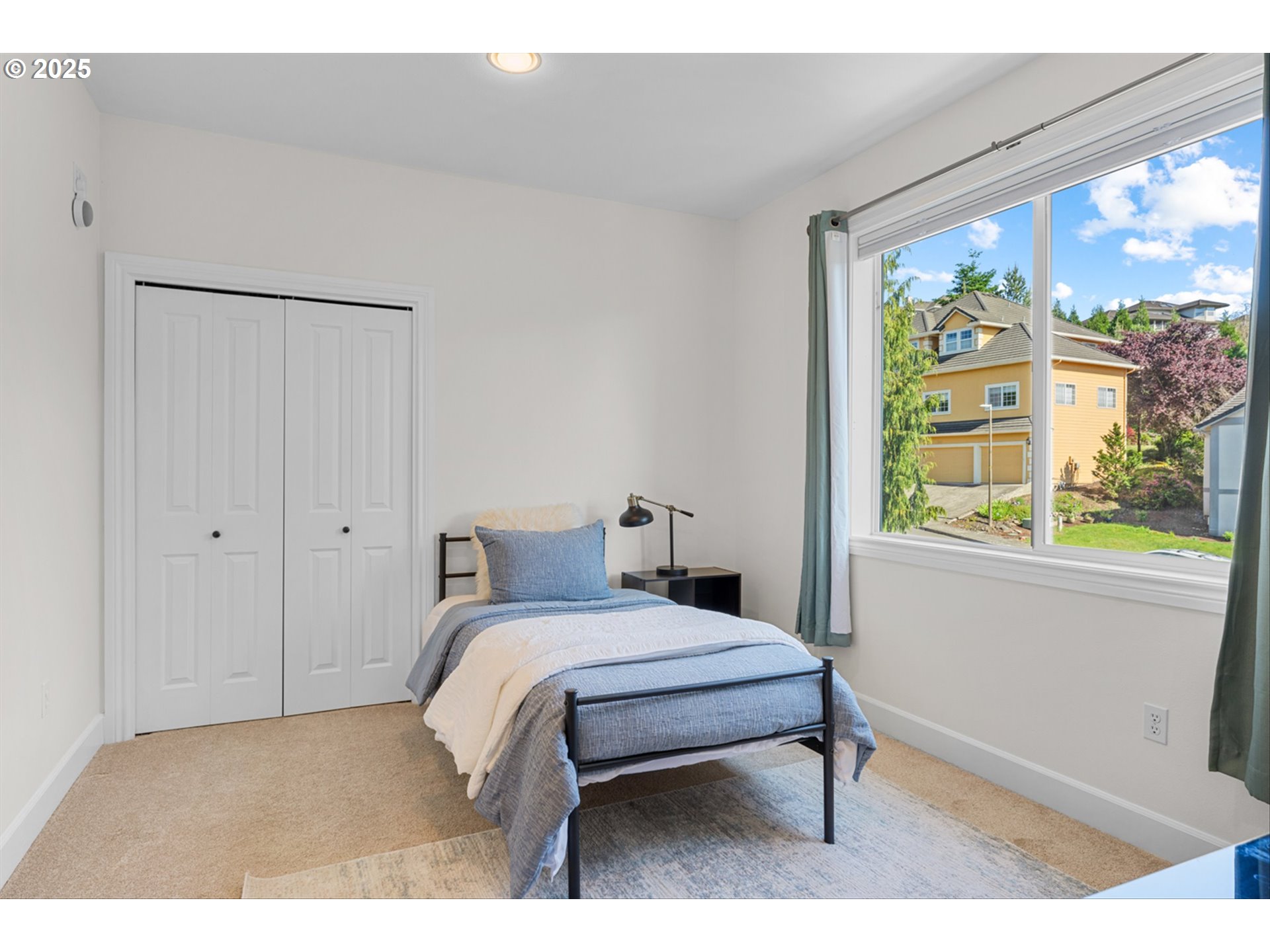 2711 Northwest 28th Circle Camas, WA 98607 - Photo 30 of 45 a bedroom with a bed and a large window