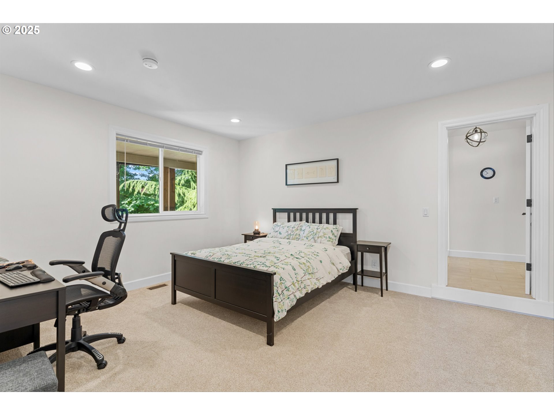 2711 Northwest 28th Circle Camas, WA 98607 - Photo 35 of 45 a bedroom with a bed a table and chair