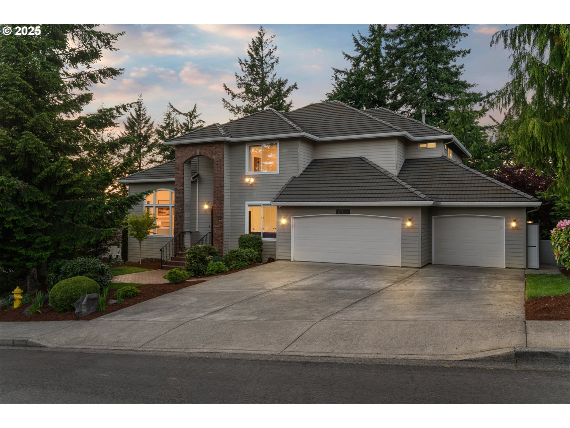2711 Northwest 28th Circle Camas, WA 98607 - Photo 41 of 45 a front view of a house with a yard and garage