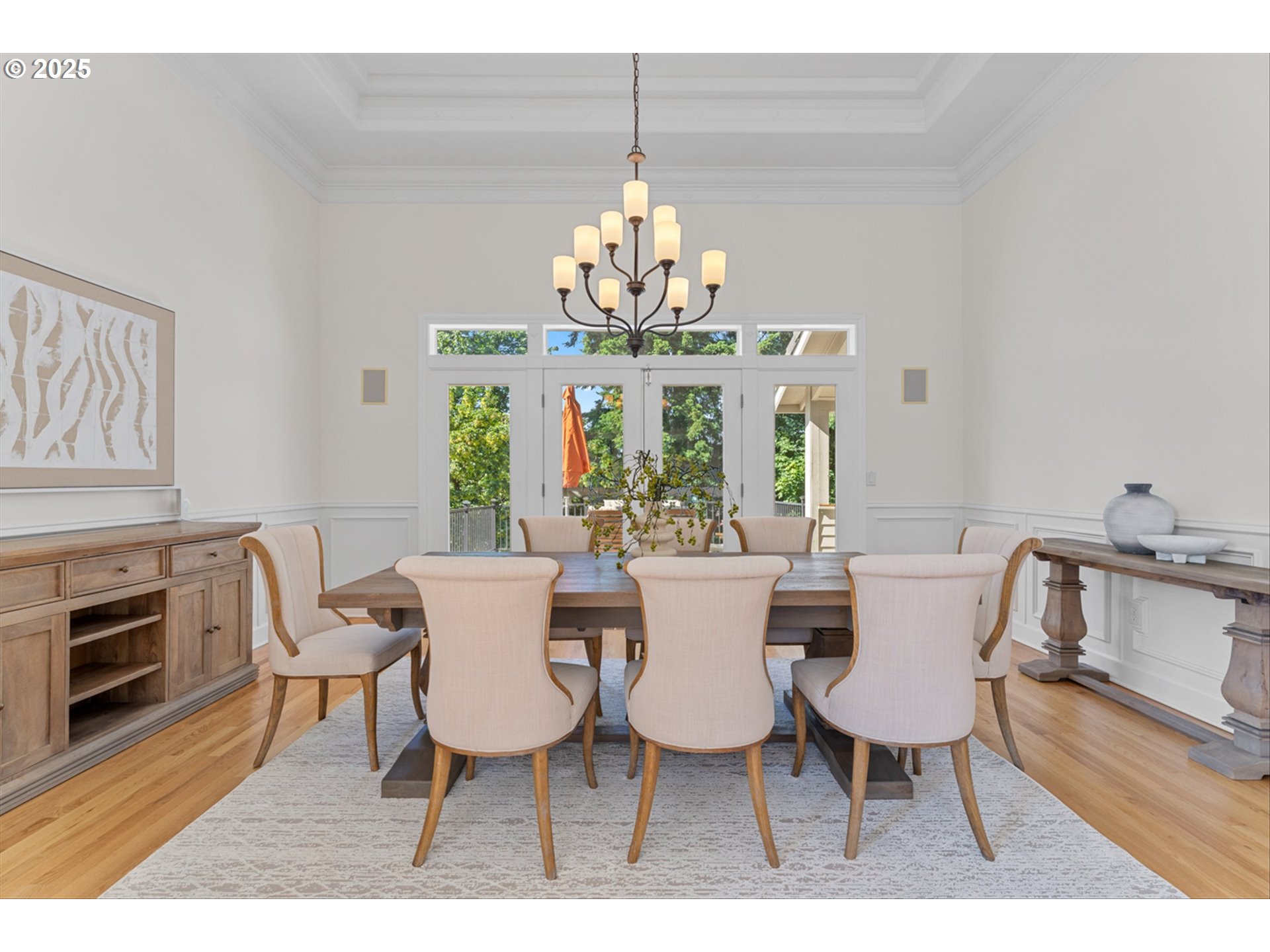 2711 Northwest 28th Circle Camas, WA 98607 - Photo 6 of 45 a view of a dining room with furniture a chandelier and wooden floor
