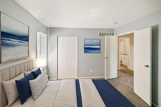 a view of bedroom with furniture and wooden floor