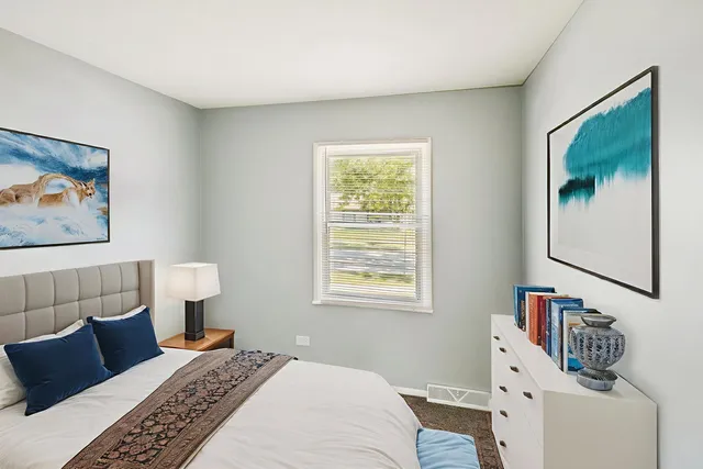 a bedroom with a bed and a couch