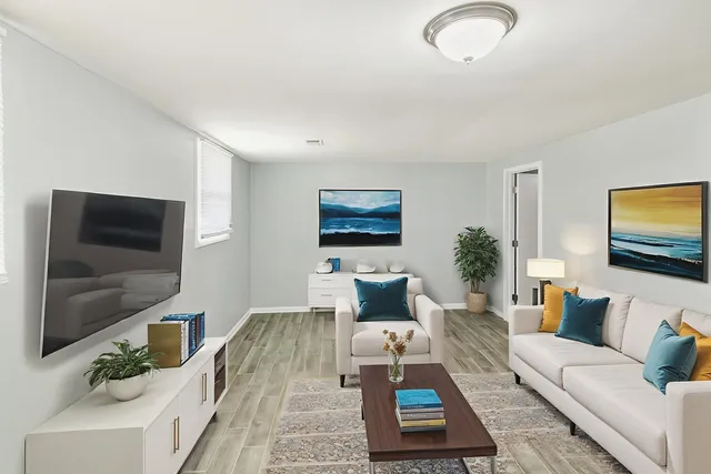 a living room with furniture and a flat screen tv