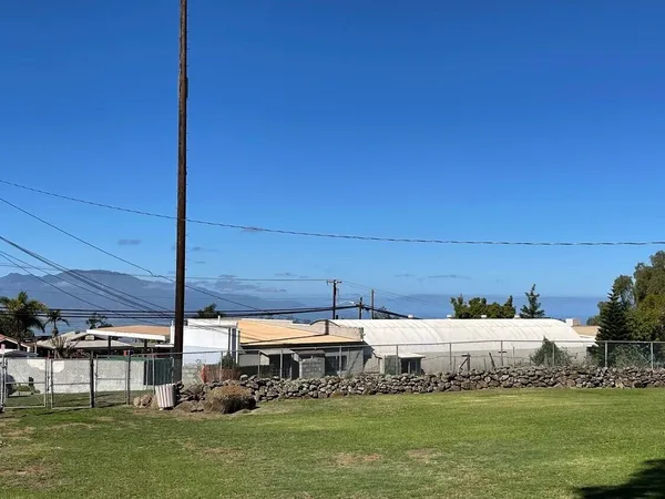 a view of a chairs and table in the balcony