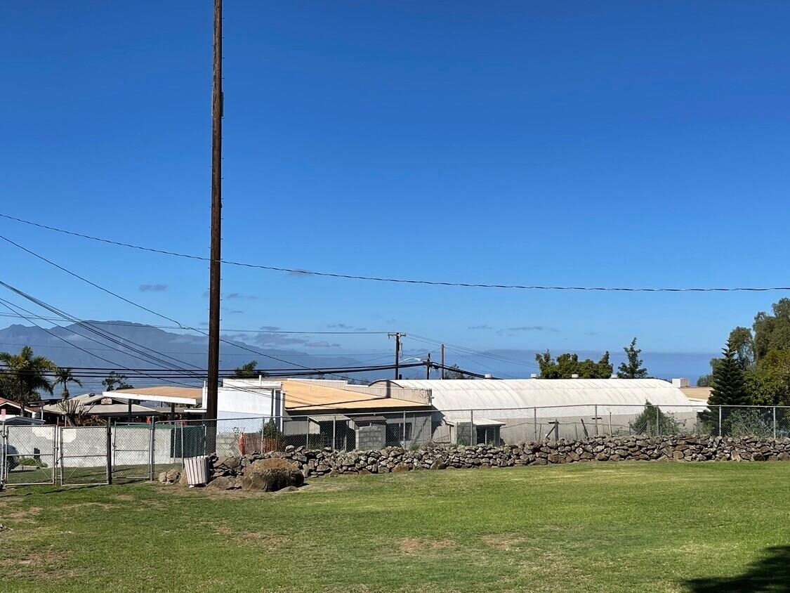 3135 Lower Kula Road Kula, HI 96790 - Photo 19 of 30 a large body of water with a building in the background