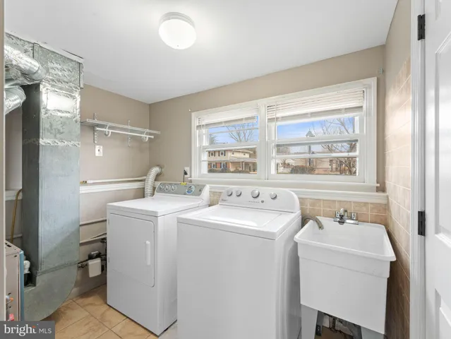 a utility room with dryer and washer