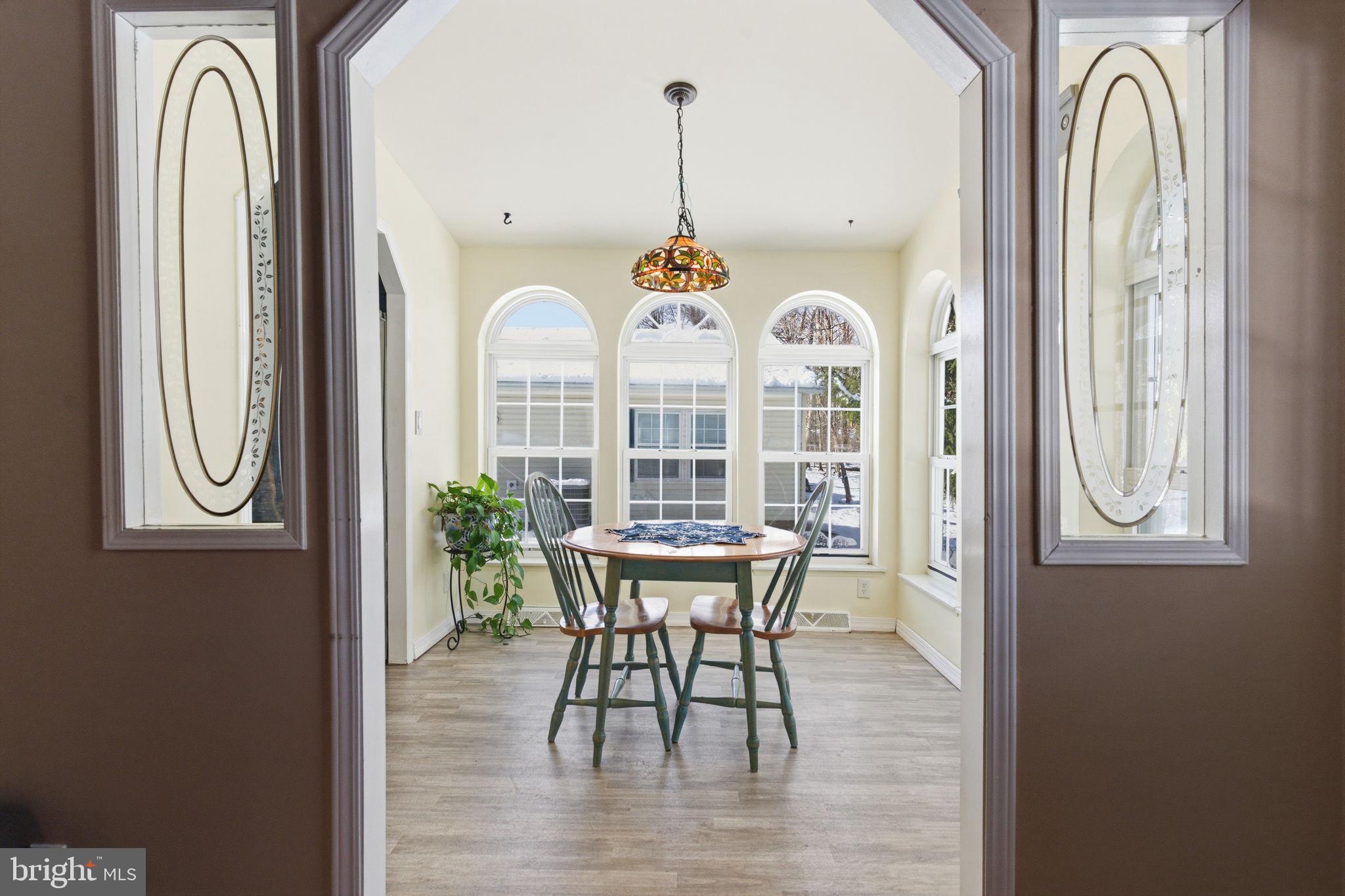 435 Spring Meadow Circle New Hope, PA 18938 - Photo 13 of 38 a view of a dining room with furniture window and outside view