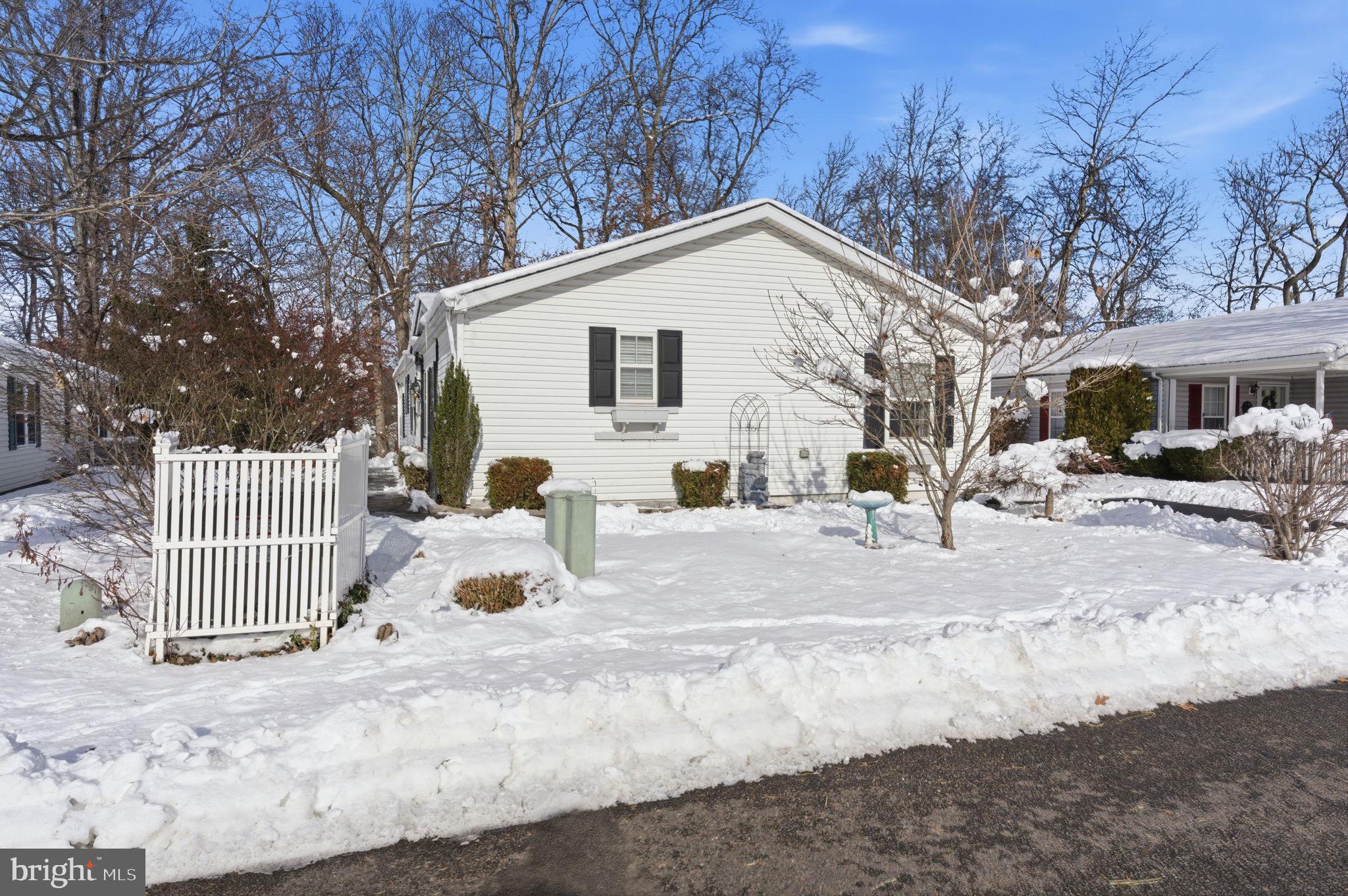 435 Spring Meadow Circle New Hope, PA 18938 - Photo 30 of 38 a view of a white house covered in snow