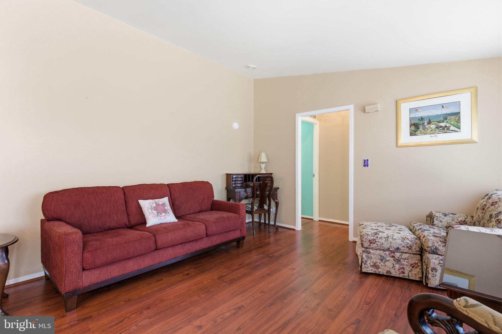 435 Spring Meadow Circle New Hope, PA 18938 - Photo 4 of 38 a living room with furniture and a wooden floor