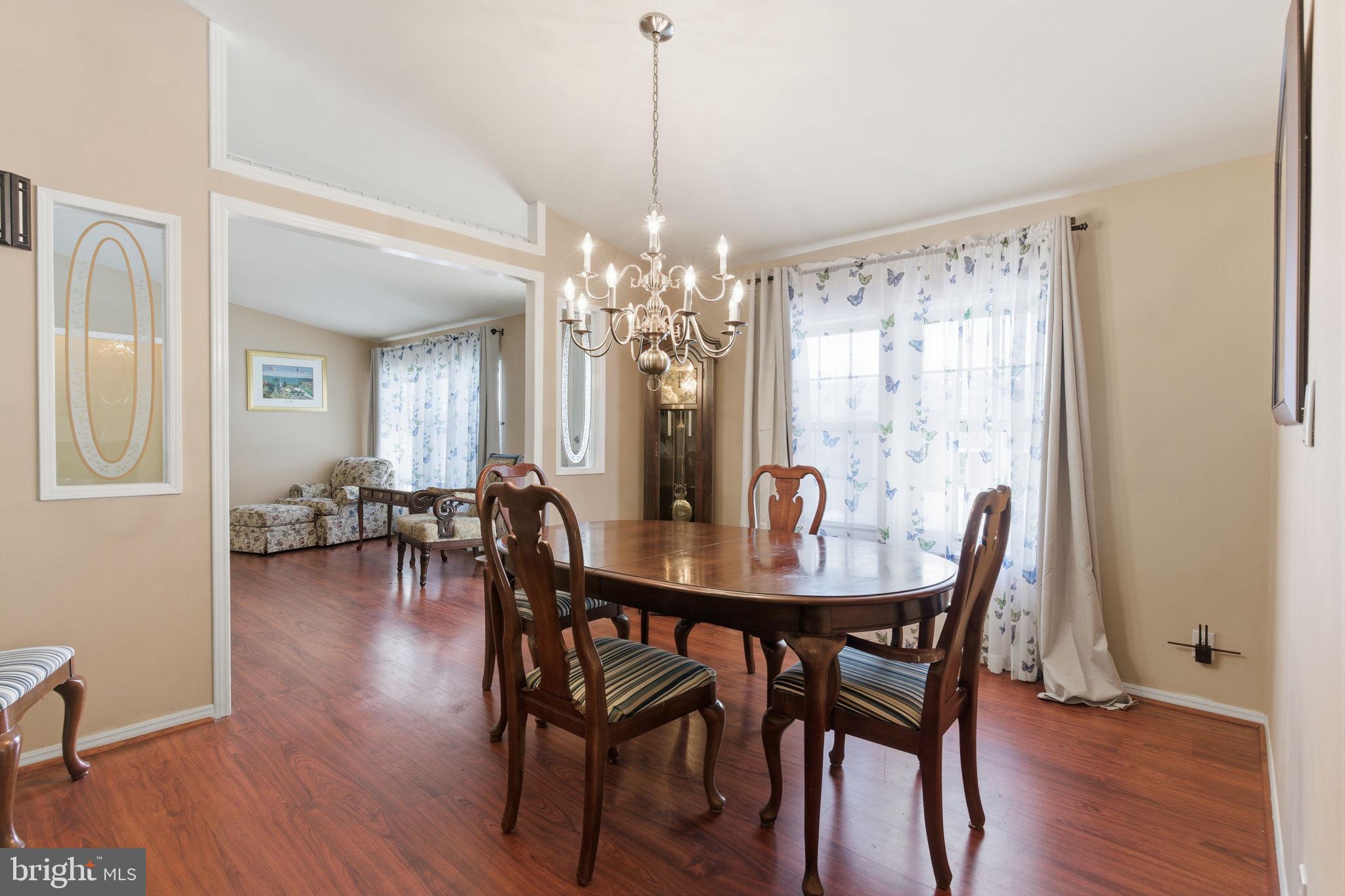 435 Spring Meadow Circle New Hope, PA 18938 - Photo 6 of 38 a view of a dining room with furniture and wooden floor