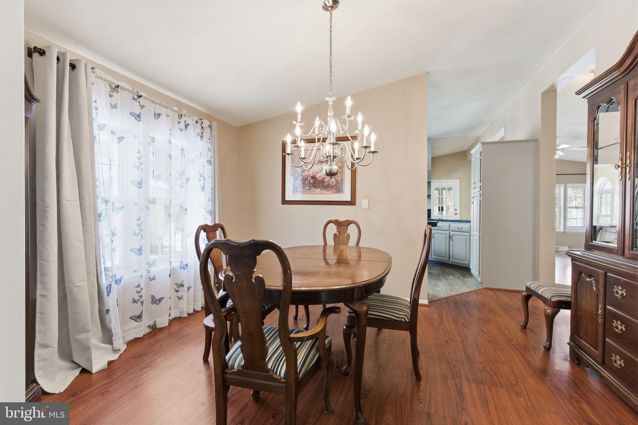 435 Spring Meadow Circle New Hope, PA 18938 - Photo 7 of 38 a view of a dining room with furniture window and wooden floor