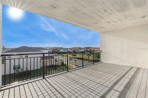 a view of balcony with wooden floor