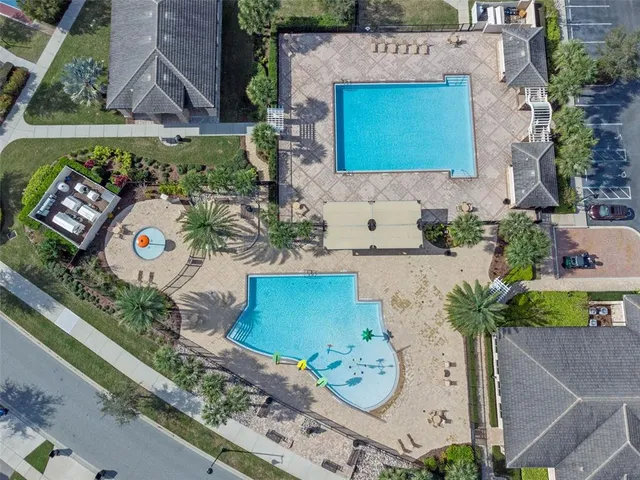 an aerial view of a house with a yard