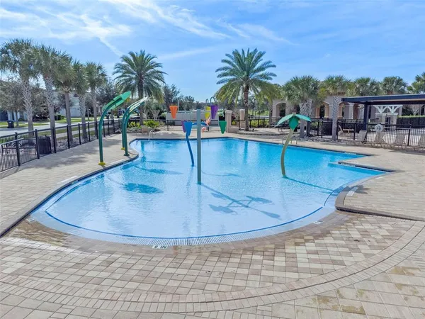 a swimming pool with outdoor seating yard and barbeque oven
