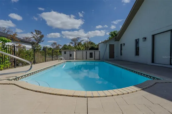 a view of a swimming pool with a porch