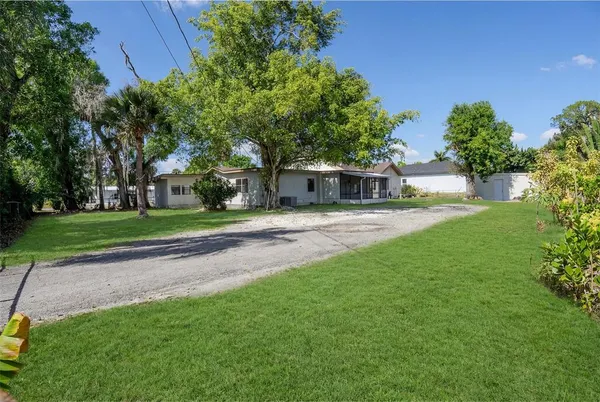 a view of a house with a big yard