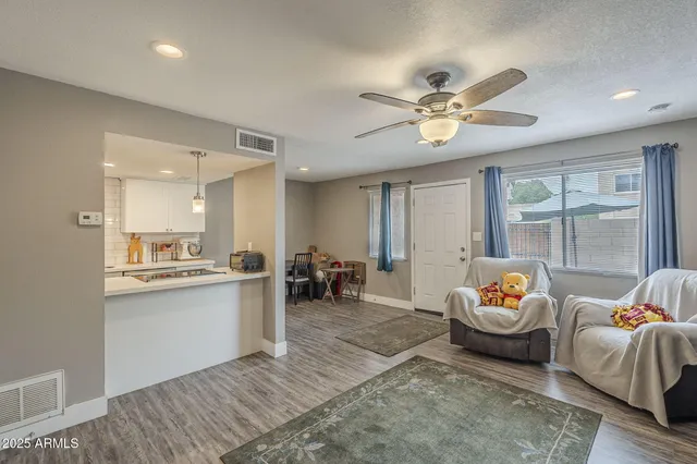 a living room with furniture and window
