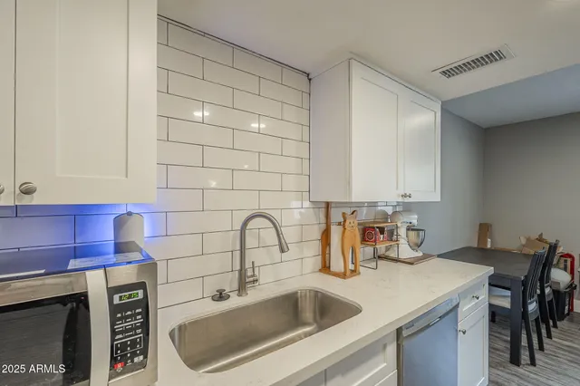 a shelf with books and knick knacks on it