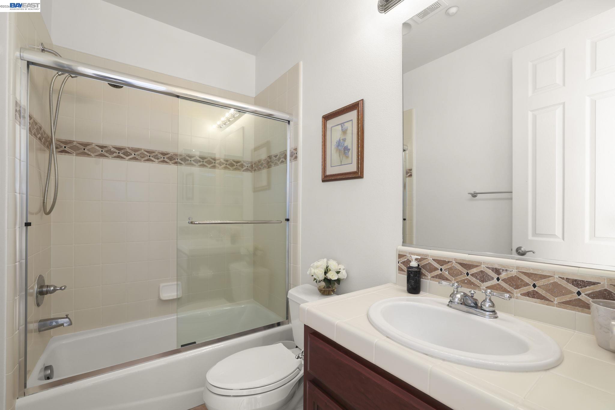950 Winsford Court San Ramon, CA 94583 - Photo 45 of 68 a bathroom with a sink and a mirror