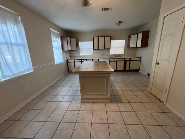 8106 County Line Road Laurel Hill, FL 32567 - Photo 2 of 13 a living room with a couch and a table