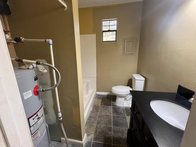 8106 County Line Road Laurel Hill, FL 32567 - Photo 7 of 13 a bathroom with a sink and a toilet