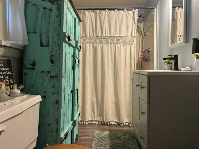 a kitchen with a sink a stove top oven and refrigerator