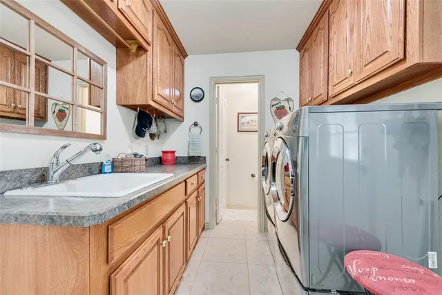 a bathroom with a granite countertop sink a toilet and a shower curtain