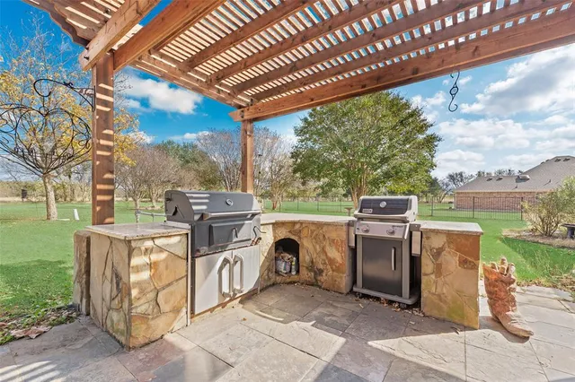 a view of a patio with a stove back yard