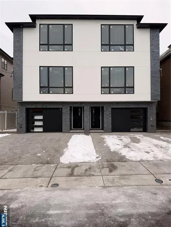 a front view of a house with barbeque