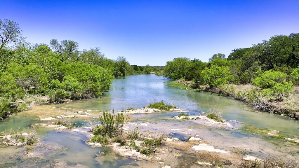 7461 Triplet Mill Road Mason, TX 76856 - Photo 18 of 46 a view of a lake with a yard