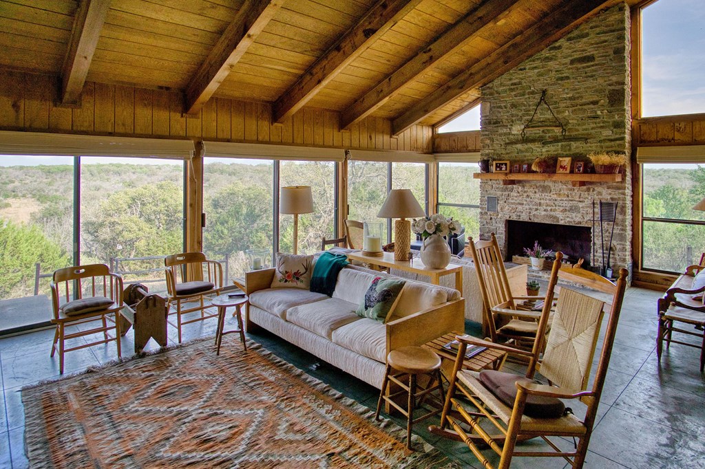 7461 Triplet Mill Road Mason, TX 76856 - Photo 28 of 46 a living room with fireplace furniture and a wooden floor