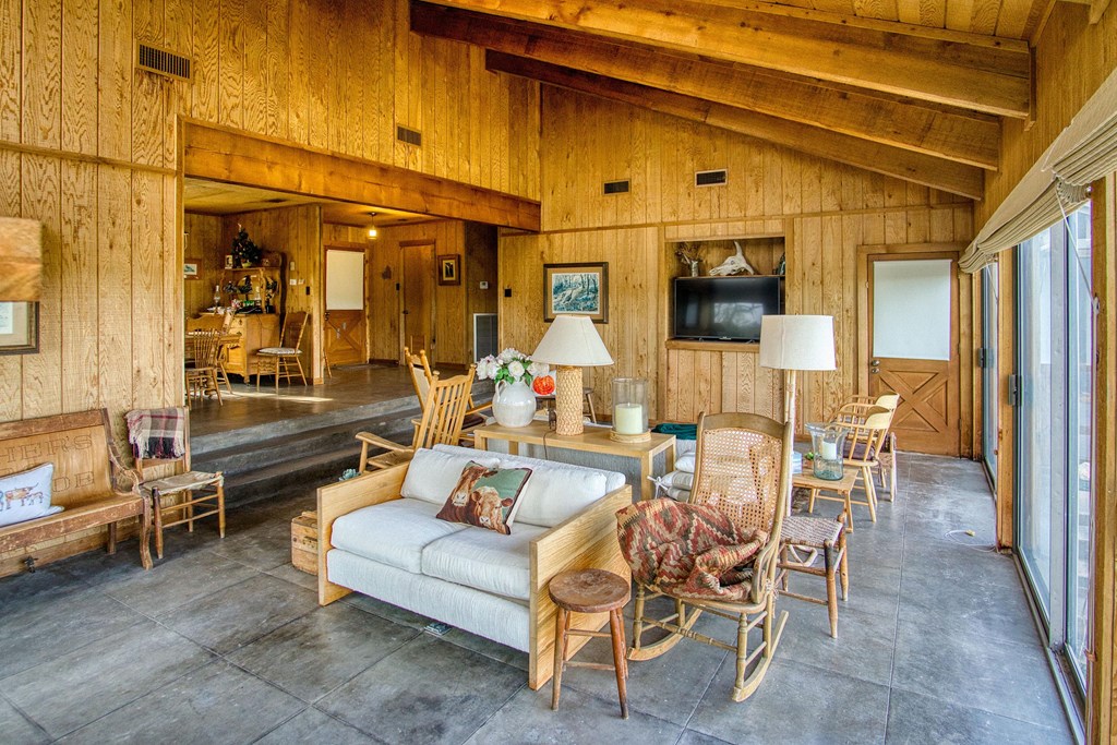 7461 Triplet Mill Road Mason, TX 76856 - Photo 29 of 46 a view of a patio with dining table and chairs with wooden floor