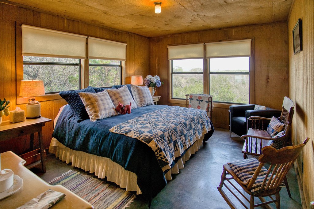 7461 Triplet Mill Road Mason, TX 76856 - Photo 32 of 46 a bedroom with bed couch and window