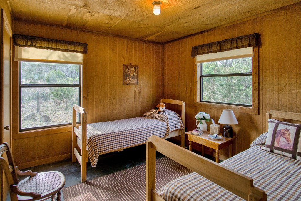 7461 Triplet Mill Road Mason, TX 76856 - Photo 34 of 46 a bedroom with furniture and a window