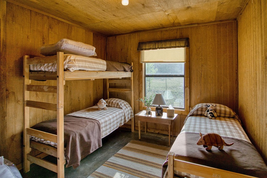 7461 Triplet Mill Road Mason, TX 76856 - Photo 35 of 46 a bedroom with a bed and a window