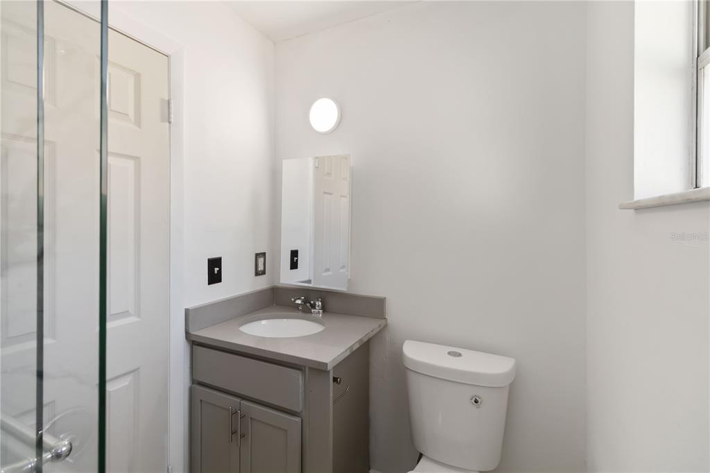 114 Palencia Road Auburndale, FL 33823 - Photo 15 of 27 a bathroom with a sink and a toilet