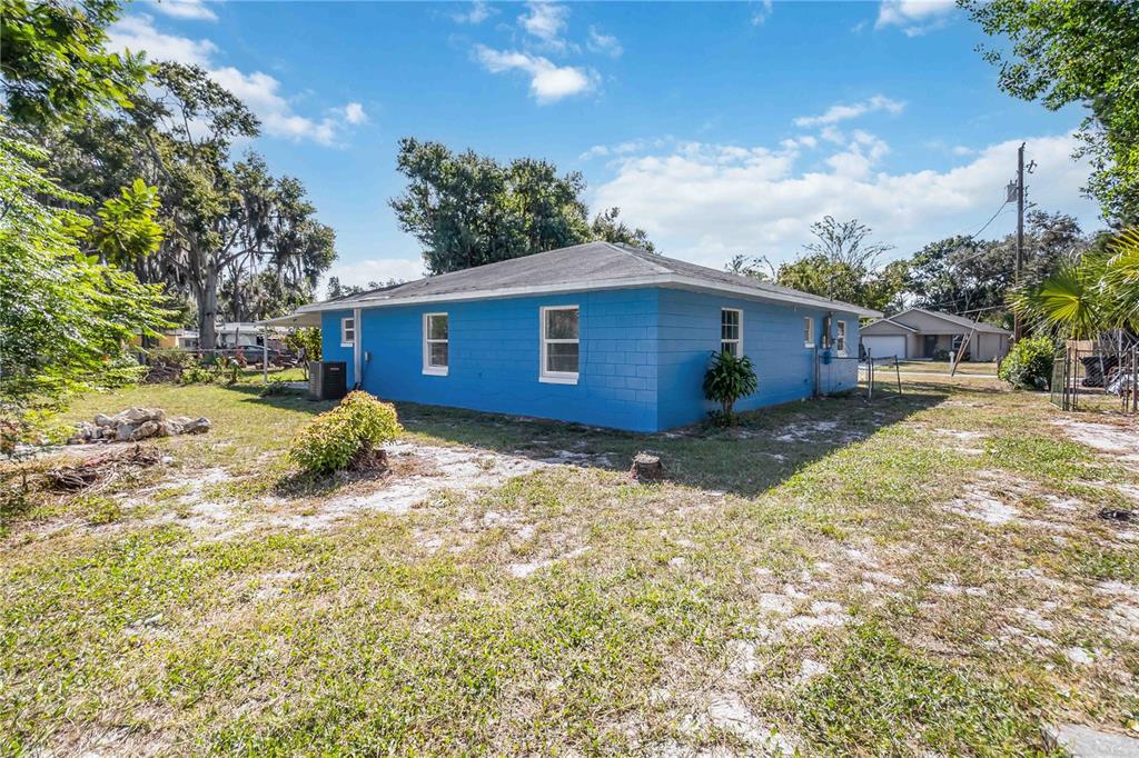 114 Palencia Road Auburndale, FL 33823 - Photo 27 of 27 a view of a house with a yard
