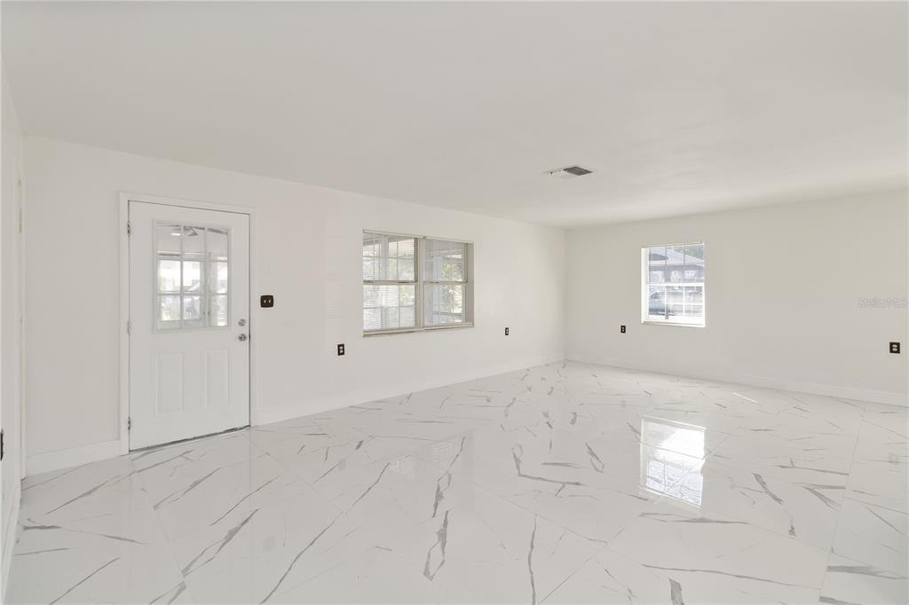 114 Palencia Road Auburndale, FL 33823 - Photo 7 of 27 a view of an empty room with a window