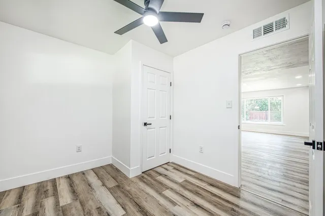 a bedroom with a bed and a television