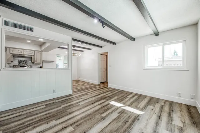 a view of an empty room and a window